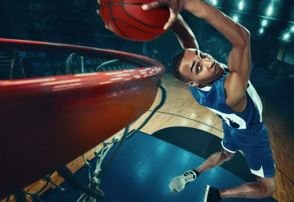 Basketball player dunking the ball.