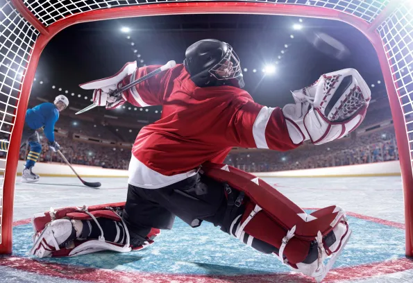 Hockey goalie catching the puck