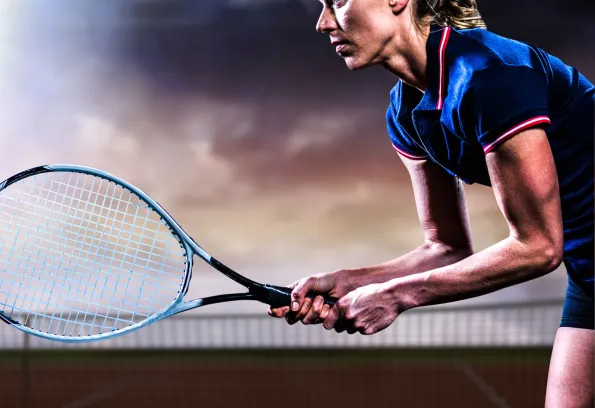 Tennis player holding racket.