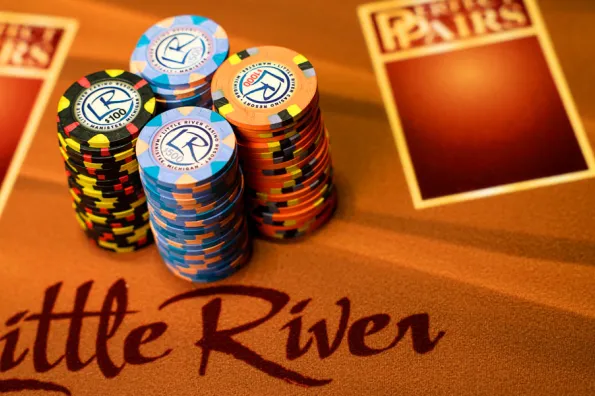 Four stacks of poker chips displayed on a Little River Table 