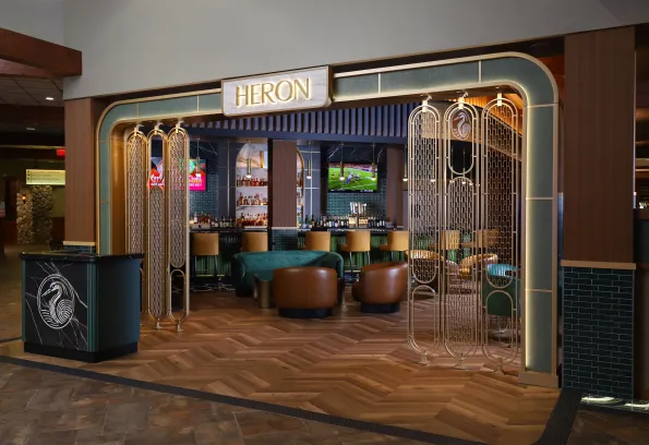 Heron restaurant at Little River Casino Resort in Manistee, Michigan, showcasing the newly opened upscale dining venue with art‑deco inspired entrance, premium bar, and modern interior design.