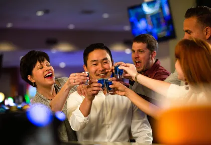 Group toasting at The Bar in Little River Casino Resort