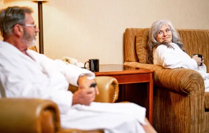 Couple enjoys coffee in a hotel room at Little River Casino Resort