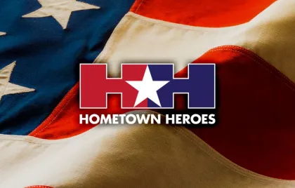 Hometown Heroes Logo over American flag