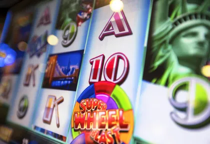 Super Wheel Blast slot machine screen featuring Statue of Liberty, Brooklyn Bridge, and New York-themed symbols at Little River Casino Resort in Manistee, Michigan