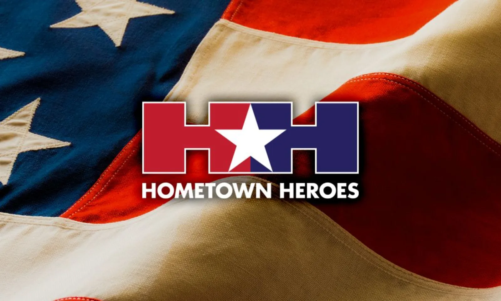 Hometown Heroes Logo over American flag