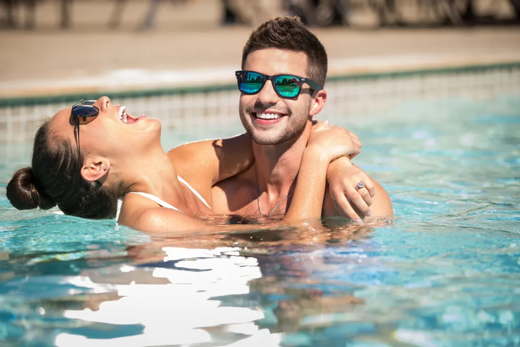 Couple enjoying the pool at Little River Casino Resort