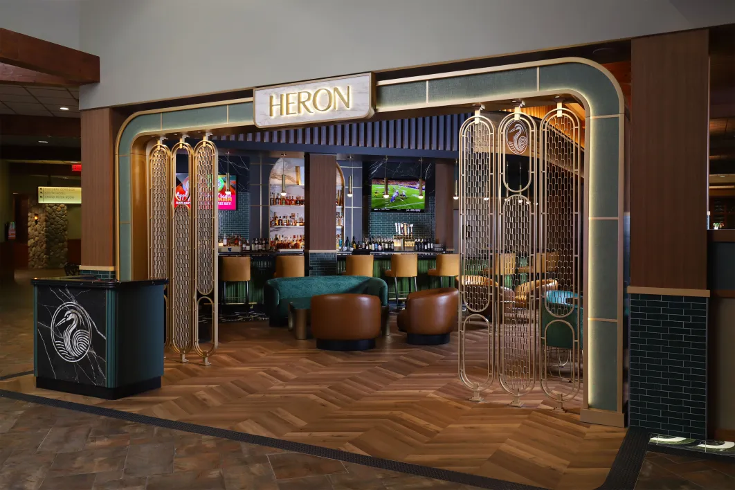 Heron restaurant at Little River Casino Resort in Manistee, Michigan, showcasing the newly opened upscale dining venue with art‑deco inspired entrance, premium bar, and modern interior design.